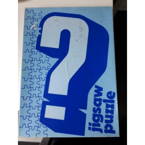 vraagteken legpuzzel. Je weet niet wat je legt. Wel fleurig