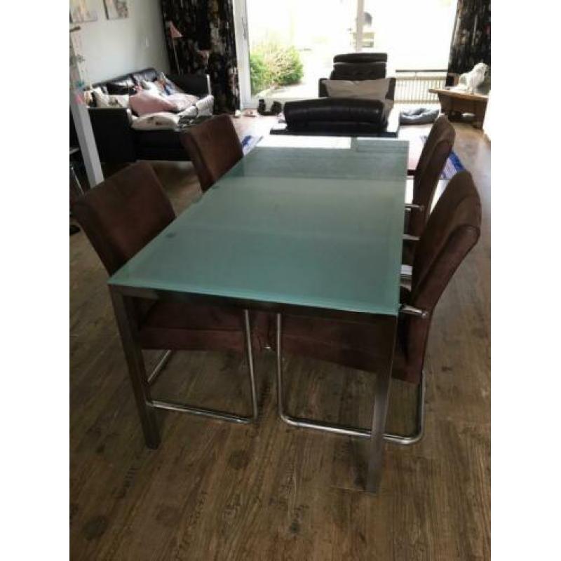 Glazen eettafel met RVS poten