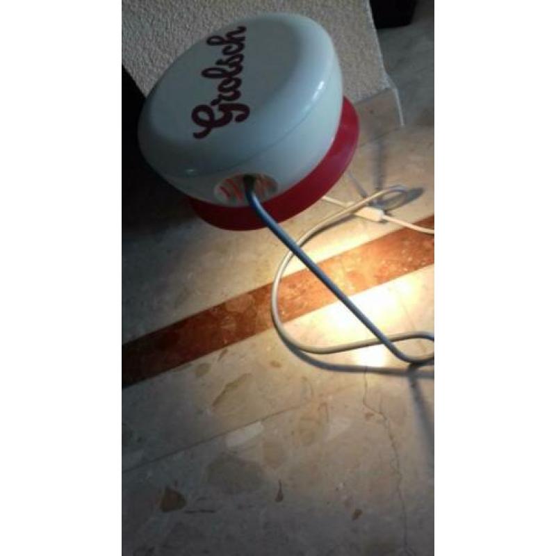 Grolsch schemerlamp in de vorm van een bierfles dop