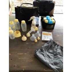 Medela handkolf, flessenwarmer en toebehoren