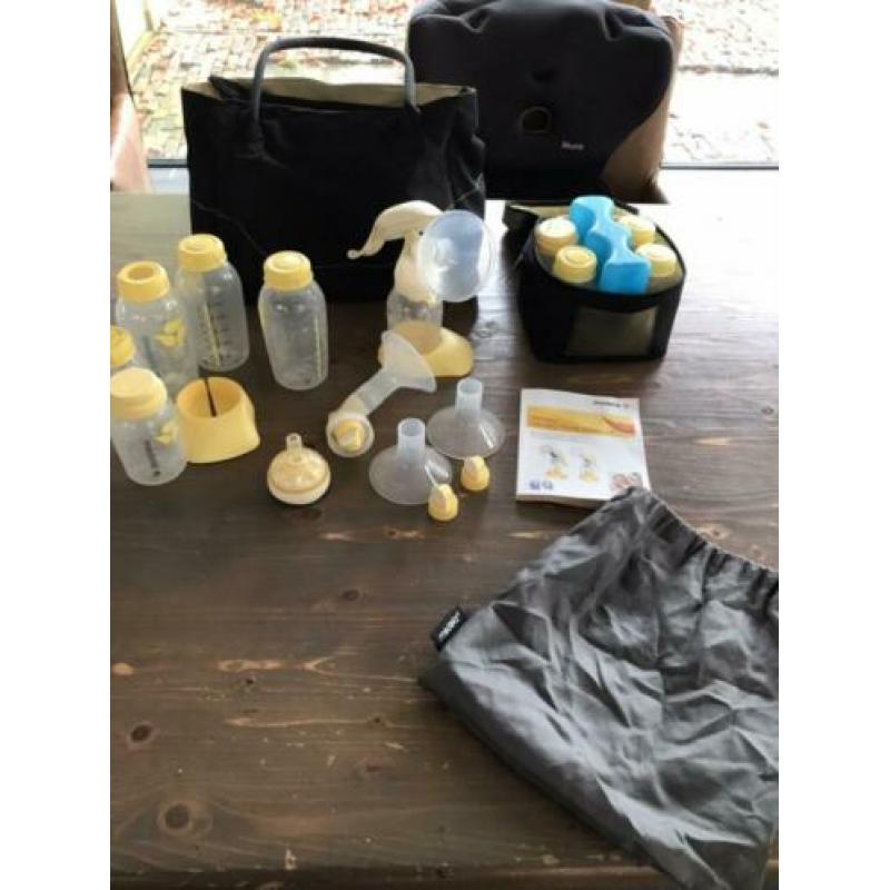 Medela handkolf, flessenwarmer en toebehoren
