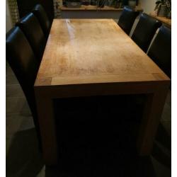 Te Koop eethoek met 6 zwarte stoelen. Maat tafel : 90-1.80