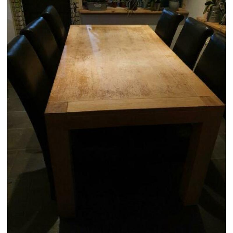 Te Koop eethoek met 6 zwarte stoelen. Maat tafel : 90-1.80