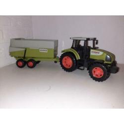 Mooie claas tractor met aanhangwagen