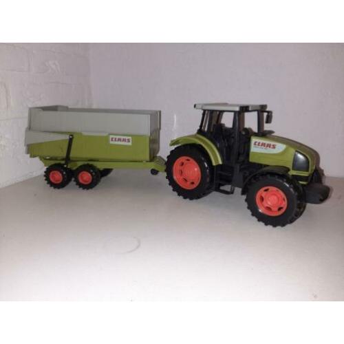 Mooie claas tractor met aanhangwagen