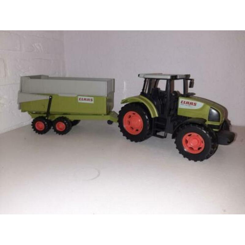 Mooie claas tractor met aanhangwagen